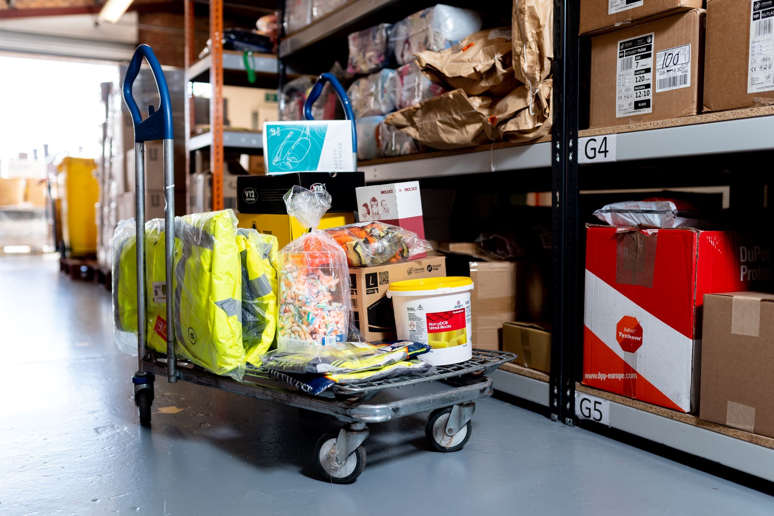 A trolley in a warehouse with assorted products on